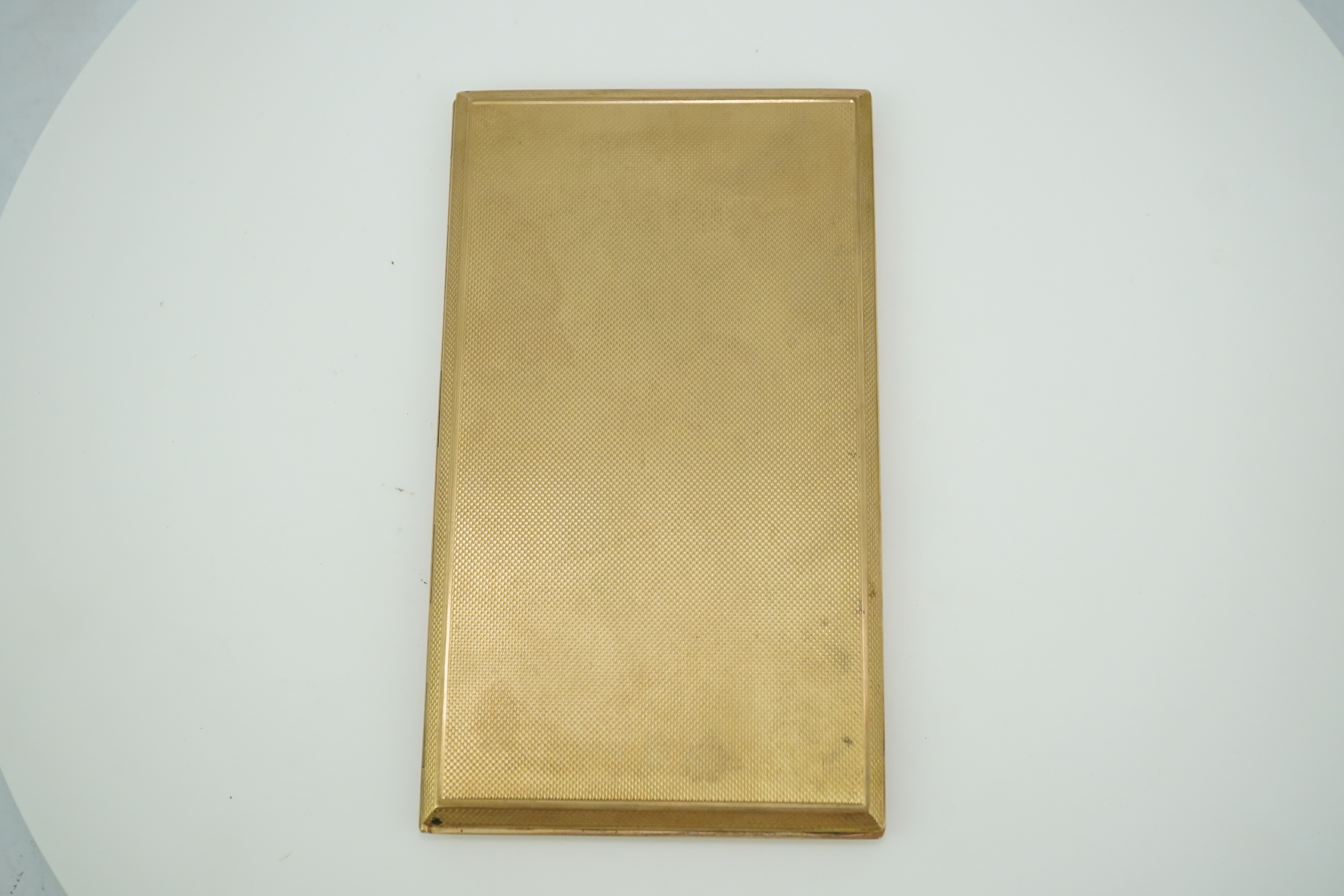 A 9ct gold cigarette case, circa 1950